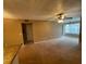 Spacious carpeted living room with ceiling fan and large window for lots of light at 5164 Conroy Rd # 1526, Orlando, FL 32811