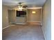 Cozy living room with ceiling fan and view of kitchen at 5164 Conroy Rd # 1526, Orlando, FL 32811