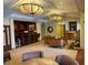 Common room with sitting areas, bar and kitchenette for community members to enjoy at 5164 Conroy Rd # 1526, Orlando, FL 32811