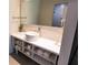 Bathroom with a bright sink, mirror, towels, and storage at 5245 W Irlo Bronson Memorial Hwy # 151, Kissimmee, FL 34746