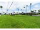 Lush lawn view features mature palms and landscaping, and nearby local attractions at 5245 W Irlo Bronson Memorial Hwy # 151, Kissimmee, FL 34746