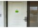 Exterior shot of the unit 151 front door showing a digital lock, peephole, and dark trim at 5245 W Irlo Bronson Memorial Hwy # 151, Kissimmee, FL 34746