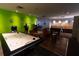 Fun game room featuring an air hockey table, arcade games, and comfortable seating at 5245 W Irlo Bronson Memorial Hwy # 151, Kissimmee, FL 34746