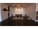 Sitting area in the lobby with a couch, seating, modern lights, and dark floors at 5245 W Irlo Bronson Memorial Hwy # 151, Kissimmee, FL 34746