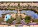 Panoramic aerial shot of the community with a clubhouse, pool, lake, and lush landscaping at 724 Greybull Run, Lake Mary, FL 32746