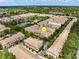 Aerial view of a well maintained, landscaped community with a pond at 724 Greybull Run, Lake Mary, FL 32746