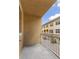 Balcony view showcasing the building's architecture, with views of a private, gated drive at 724 Greybull Run, Lake Mary, FL 32746