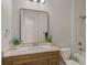 Bathroom featuring a wood vanity with a mirror, toilet, and a bathtub with shower at 724 Greybull Run, Lake Mary, FL 32746