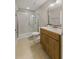 Modern bathroom featuring a glass enclosed shower, vanity with a white countertop, and neutral tile flooring at 724 Greybull Run, Lake Mary, FL 32746