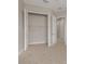 This empty bedroom features neutral paint, carpet, a closet and a doorway to another room at 724 Greybull Run, Lake Mary, FL 32746