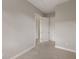 Empty bedroom showing the doorway into the hall and doorway into a closet at 724 Greybull Run, Lake Mary, FL 32746