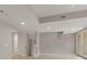 Bright bonus room features stairs, recessed lights, tile flooring, and doors that lead to an outdoor patio at 724 Greybull Run, Lake Mary, FL 32746