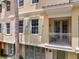Multi-story townhome in a coastal community with a small balcony and covered entrance at 724 Greybull Run, Lake Mary, FL 32746