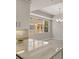Bright kitchen features granite countertops, modern light fixture, and a large window with a view at 724 Greybull Run, Lake Mary, FL 32746