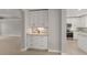 Well-designed kitchen and dining area with white cabinets, stainless steel appliances, and granite countertops at 724 Greybull Run, Lake Mary, FL 32746