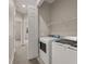 Convenient laundry room with white washer and dryer at 724 Greybull Run, Lake Mary, FL 32746