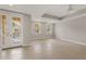 Bright living room features recessed lighting, tile floors, and french doors to the balcony at 724 Greybull Run, Lake Mary, FL 32746
