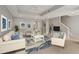 Bright living room features tile floors, neutral walls, white furniture and blue accents at 724 Greybull Run, Lake Mary, FL 32746