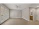 Bright living room featuring neutral tones, tile floors, ceiling fan, and sliding glass doors for plenty of natural light at 724 Greybull Run, Lake Mary, FL 32746