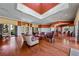 Clubhouse lobby area with multiple seating areas, wood floors and high ceilings at 724 Greybull Run, Lake Mary, FL 32746