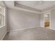 Spacious main bedroom with tray ceiling and en-suite bathroom access at 724 Greybull Run, Lake Mary, FL 32746