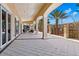 Covered outdoor patio with tiled flooring, arched pillars, and a seating area overlooking scenic views at 724 Greybull Run, Lake Mary, FL 32746
