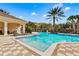 Beautiful community pool and spa surrounded by lush landscaping and comfortable lounge chairs at 724 Greybull Run, Lake Mary, FL 32746