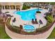 Resort-style pool and hot tub area with lounge chairs surrounded by lush landscaping at 724 Greybull Run, Lake Mary, FL 32746