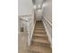 Carpeted staircase leading to the upper level, with a view of bathroom and lower level at 724 Greybull Run, Lake Mary, FL 32746