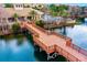 Waterfront community featuring a lake, wooden pier, and luxurious landscaping at 724 Greybull Run, Lake Mary, FL 32746