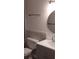 Well-lit bathroom with gray vanity and subway tile at 9315 9Th Ave, Orlando, FL 32824