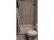 Clean bathroom featuring tiled shower and modern curtain at 9315 9Th Ave, Orlando, FL 32824