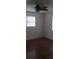 A simple, well-lit bedroom with ceiling fan and laminate flooring offers comfort and functionality at 9315 9Th Ave, Orlando, FL 32824