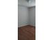Empty bedroom featuring wood flooring and neutral paint at 9315 9Th Ave, Orlando, FL 32824