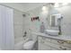 Well lit bathroom including a tub with shower, a vessel sink, and updated hardware at 1023 Royal Oaks Dr, Apopka, FL 32703