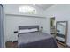 Comfortable bedroom featuring a large window, cozy bed, and an attached bathroom for convenience at 1023 Royal Oaks Dr, Apopka, FL 32703