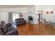 Spacious living room featuring wood floors, high ceilings, and a ceiling fan at 1023 Royal Oaks Dr, Apopka, FL 32703