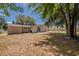 Large backyard featuring a sliding glass door and a patio area, ideal for outdoor entertaining at 1084 Doyle Rd, Deltona, FL 32725