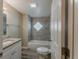 Bathroom featuring a tub and shower with decorative glass block window at 1084 Doyle Rd, Deltona, FL 32725