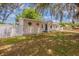 Charming single-story home with white fence and green lawn in the front yard at 1084 Doyle Rd, Deltona, FL 32725