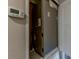 Carrier HVAC system in utility closet with digital thermostat at 1084 Doyle Rd, Deltona, FL 32725