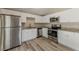 Beautiful kitchen features stainless steel appliances, granite countertops, and white cabinets at 1084 Doyle Rd, Deltona, FL 32725