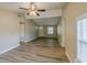 Living room with vaulted ceilings, neutral walls, and wood-look flooring at 1084 Doyle Rd, Deltona, FL 32725