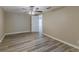 Main bedroom featuring wood-look flooring, neutral paint, and ceiling fan at 1084 Doyle Rd, Deltona, FL 32725