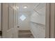 Spacious walk-in closet with wire shelving and modern wood-look flooring at 1084 Doyle Rd, Deltona, FL 32725
