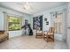 This spacious bedroom features neutral tile floors, two windows, and a ceiling fan at 1100 Oday Dr, Winter Springs, FL 32708