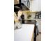 Galley style kitchen with laminate counters and black appliances at 1100 Oday Dr, Winter Springs, FL 32708