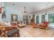 Cozy living room featuring tile floors, ceiling fan, natural lighting and comfortable seating at 1100 Oday Dr, Winter Springs, FL 32708