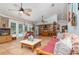 Inviting living room with tile flooring, ceiling fans, natural light, and access to the pool area at 1100 Oday Dr, Winter Springs, FL 32708