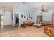 Bright living room with tile floors, guitars on the wall, and comfortable seating at 1100 Oday Dr, Winter Springs, FL 32708